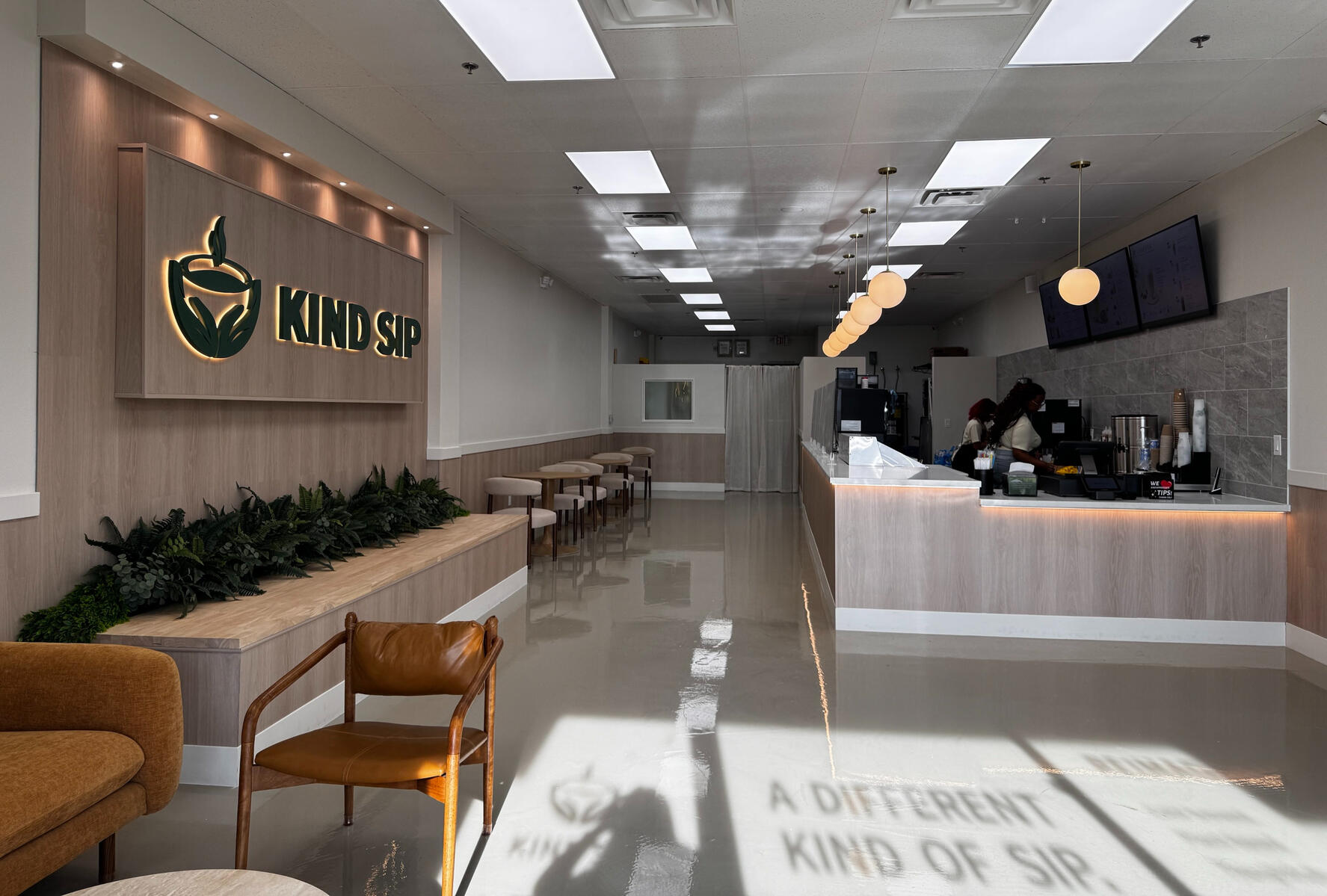 Augue interdum Interior of Kind Sip café with seating and a coffee bar